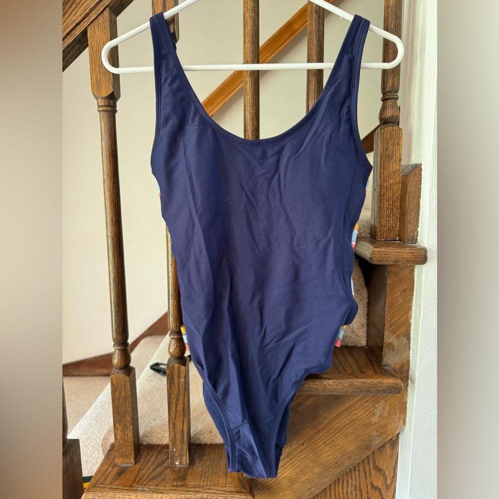 Blue one piece swim suit with size cut outs